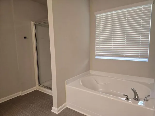 a white bath tub sitting next to a window