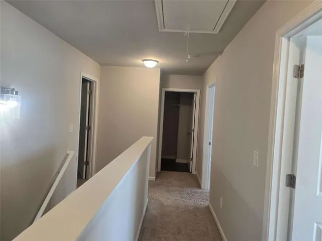 an empty room with wooden floor and a window
