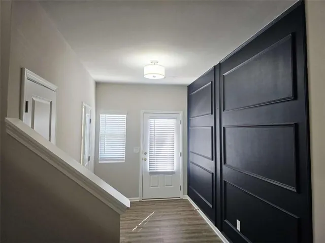 a view of hallway with an empty room