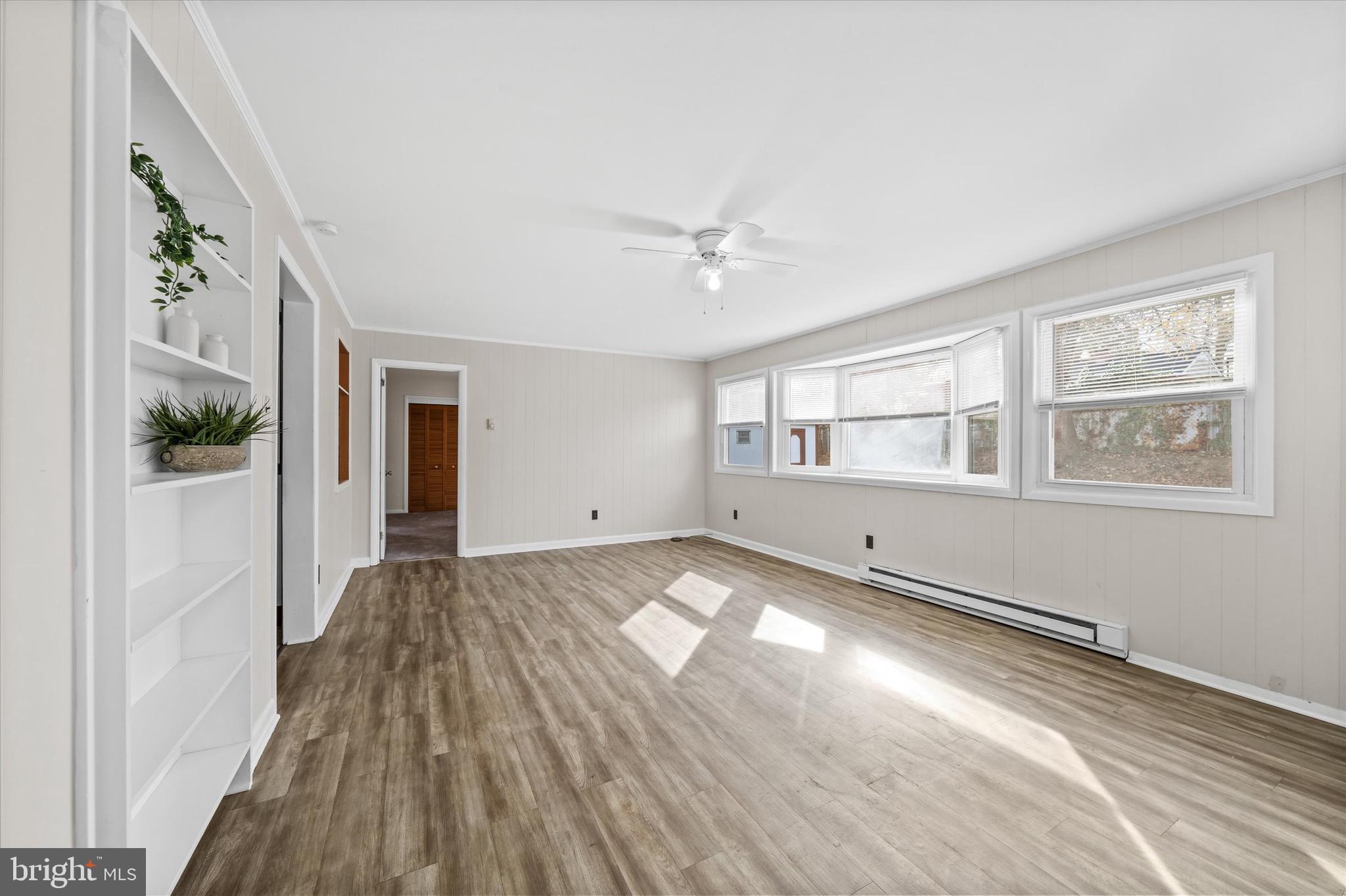 124 Festone Avenue New Castle, DE 19720 - Photo 18 of 43 wooden floor in an empty room with a window