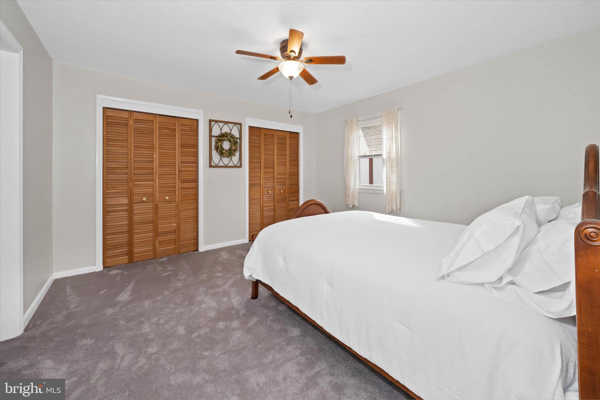 124 Festone Avenue New Castle, DE 19720 - Photo 23 of 43 a bedroom with a bed and a ceiling fan
