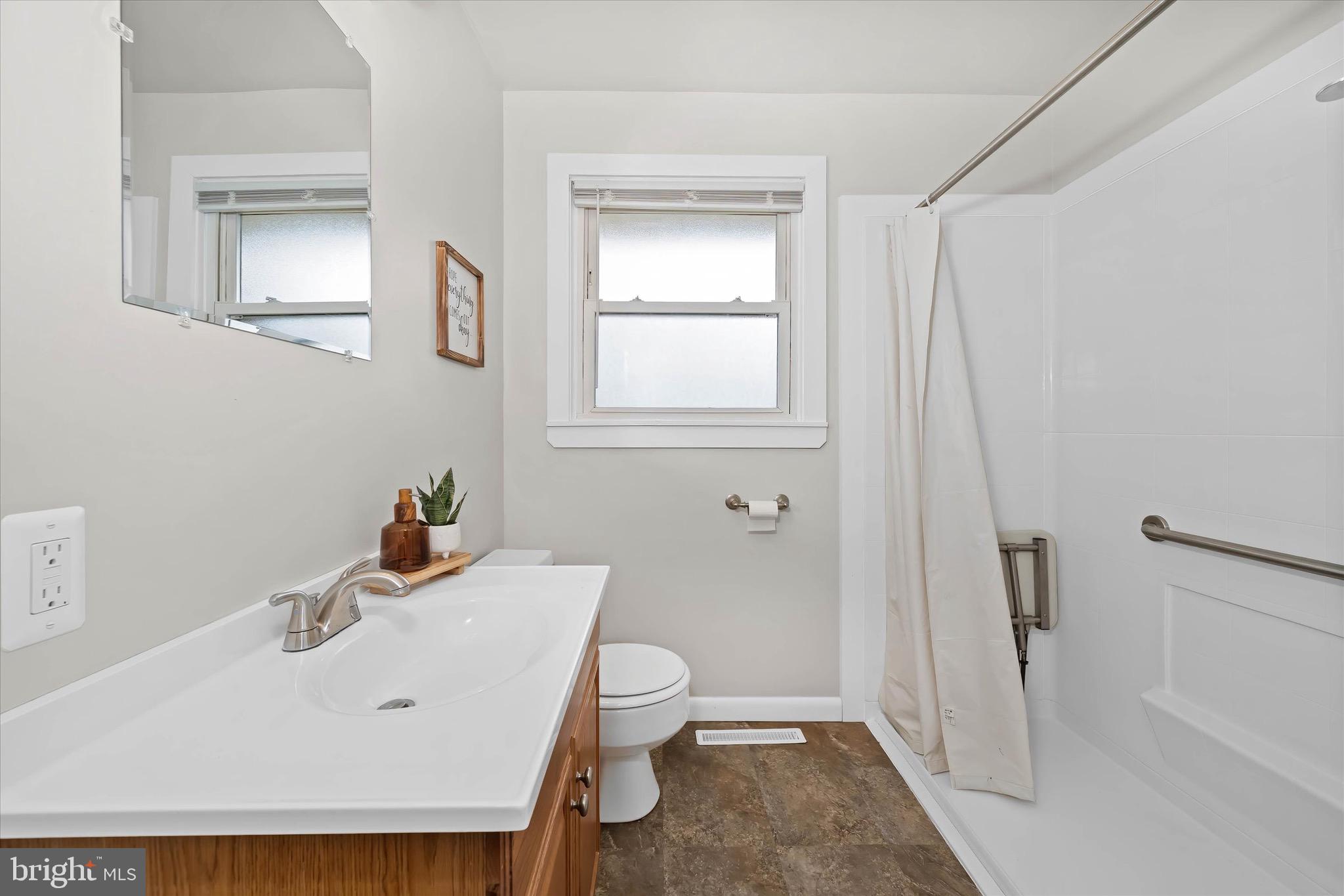 124 Festone Avenue New Castle, DE 19720 - Photo 29 of 43 a bathroom with a sink a toilet and shower