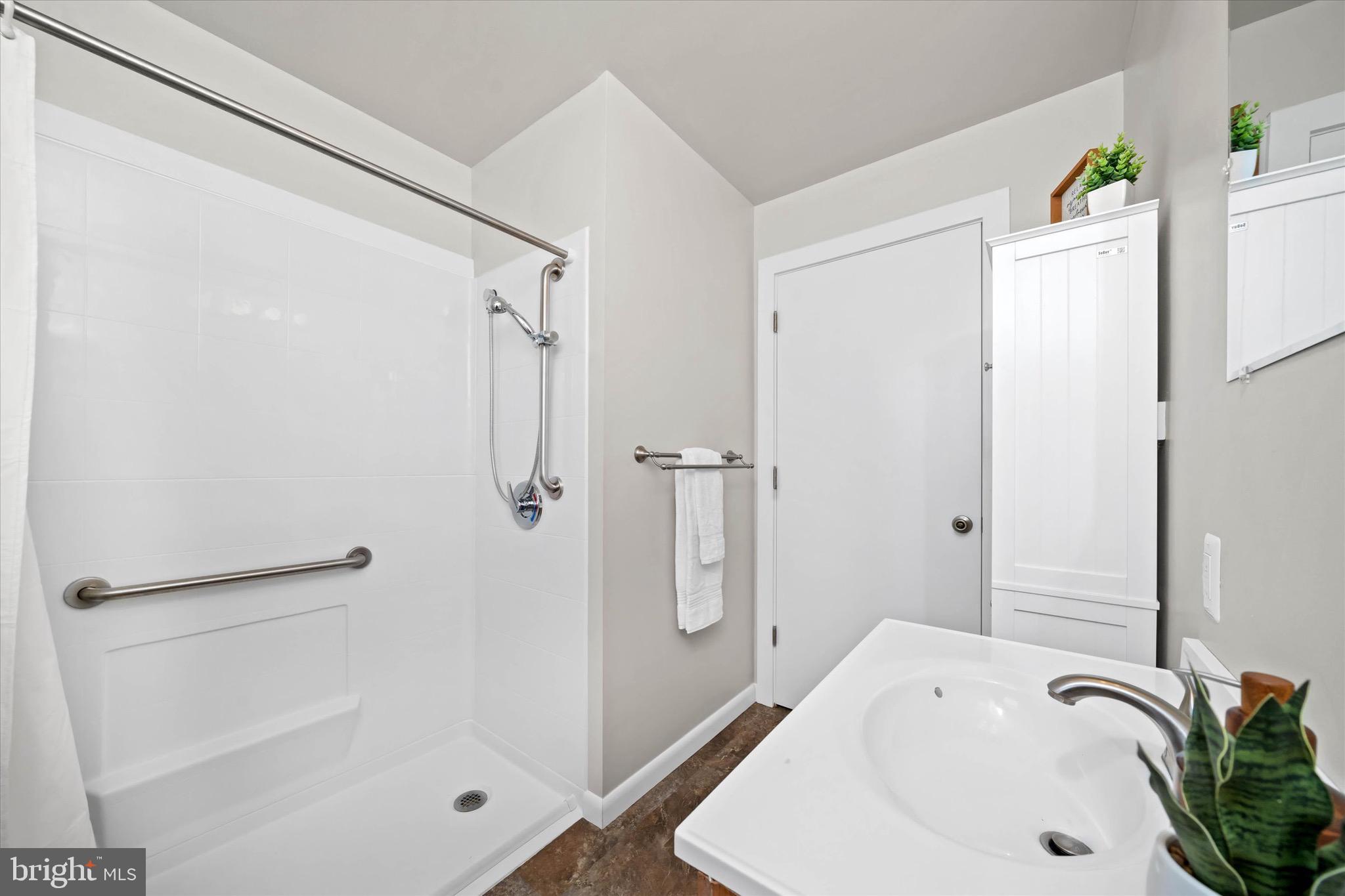 124 Festone Avenue New Castle, DE 19720 - Photo 30 of 43 a bathroom with a sink and a shower