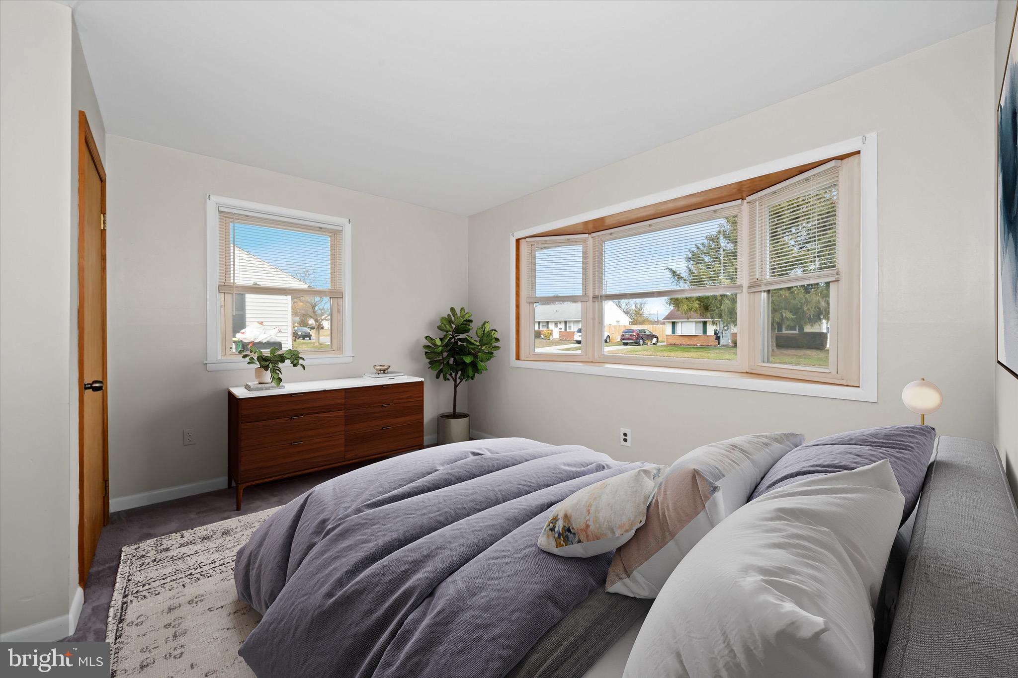 124 Festone Avenue New Castle, DE 19720 - Photo 34 of 43 a bedroom with a large bed and a window