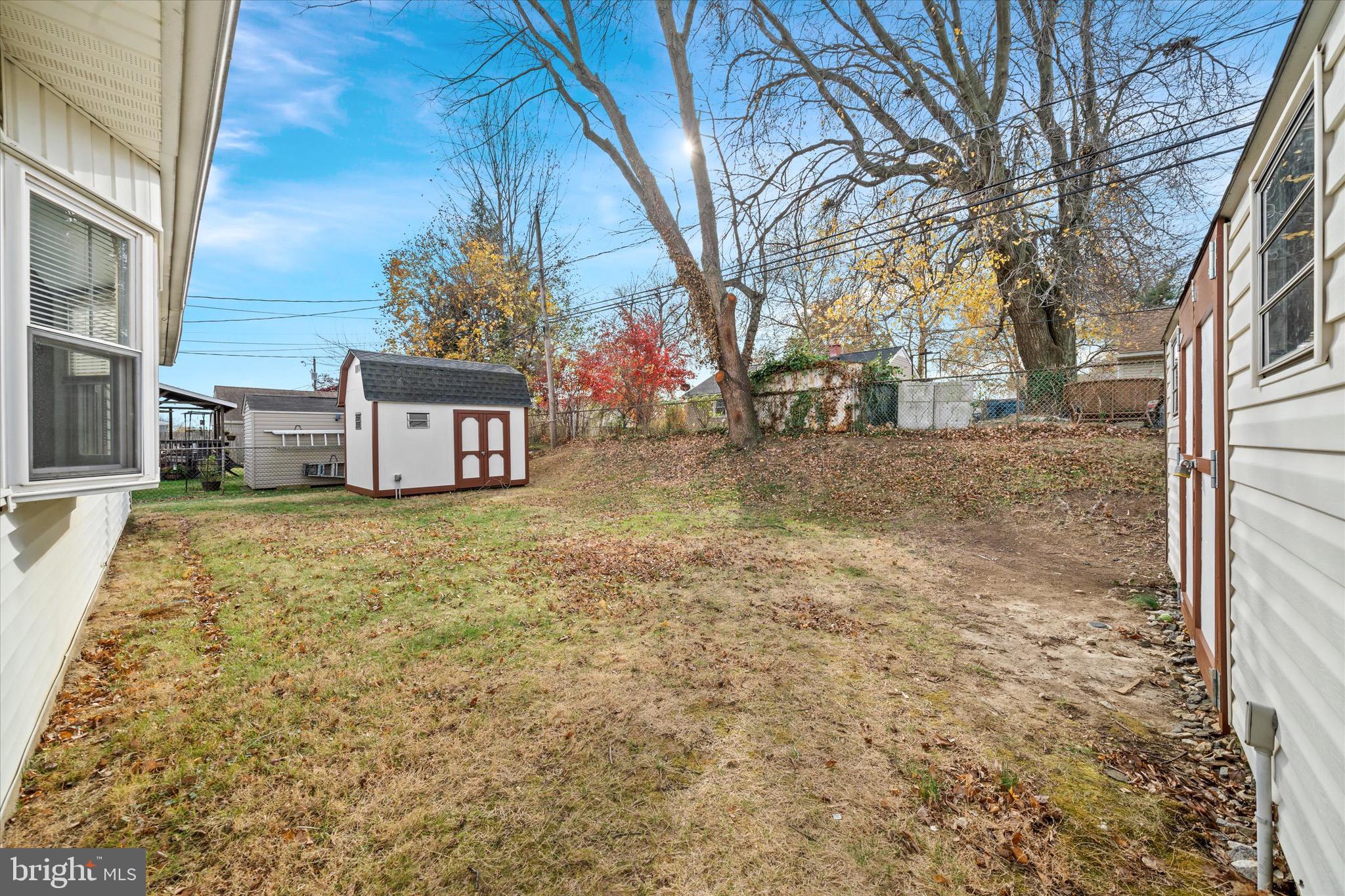 124 Festone Avenue New Castle, DE 19720 - Photo 39 of 43 a front view of a house with a yard and garage