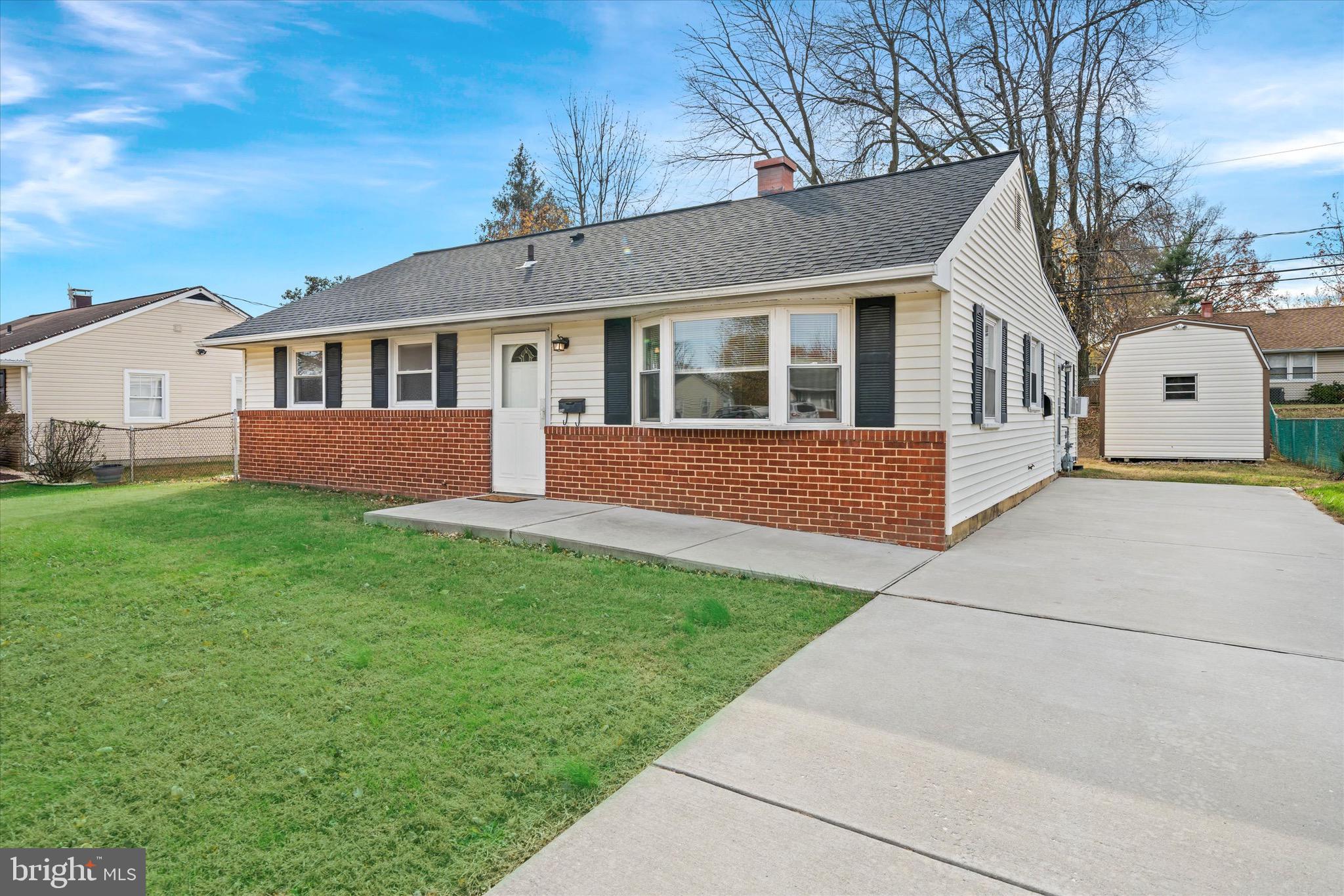 124 Festone Avenue New Castle, DE 19720 - Photo 4 of 43 a front view of a house with yard