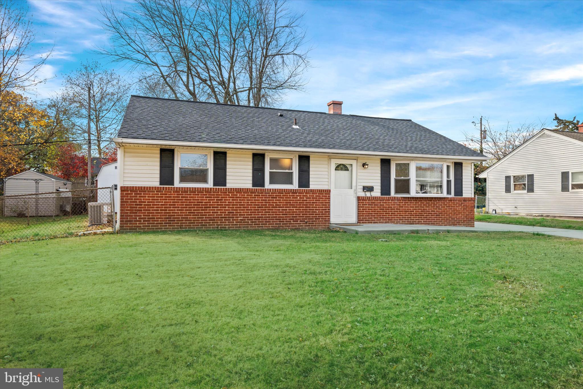 124 Festone Avenue New Castle, DE 19720 - Photo 42 of 43 a front view of a house with a yard