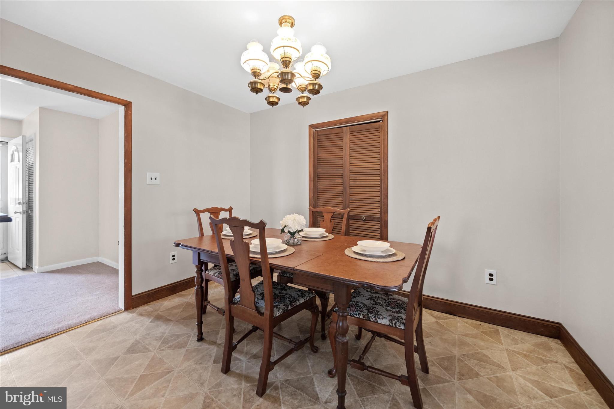 124 Festone Avenue New Castle, DE 19720 - Photo 8 of 43 a view of a dining room with furniture and chandelier