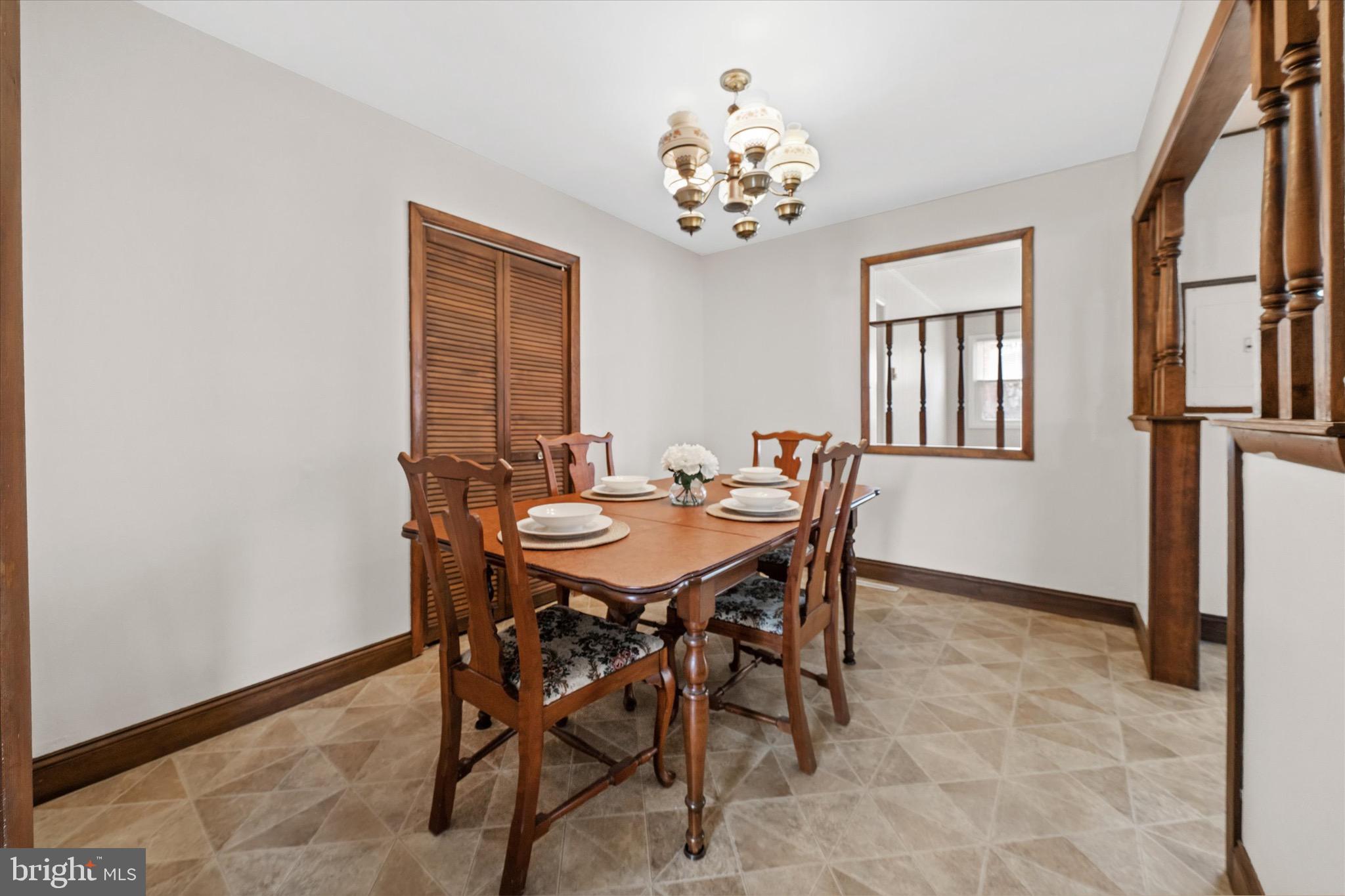 124 Festone Avenue New Castle, DE 19720 - Photo 9 of 43 a view of a dining room with furniture and chandelier