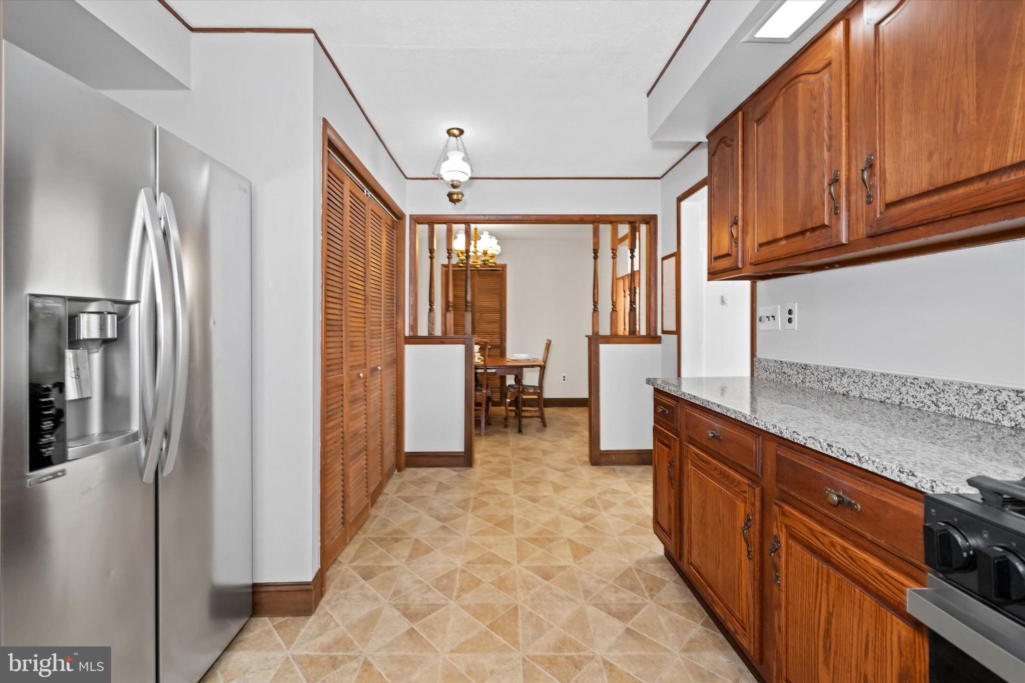 124 Festone Avenue New Castle, DE 19720 - Photo 10 of 43 a kitchen with stainless steel appliances granite countertop a refrigerator and a stove top oven