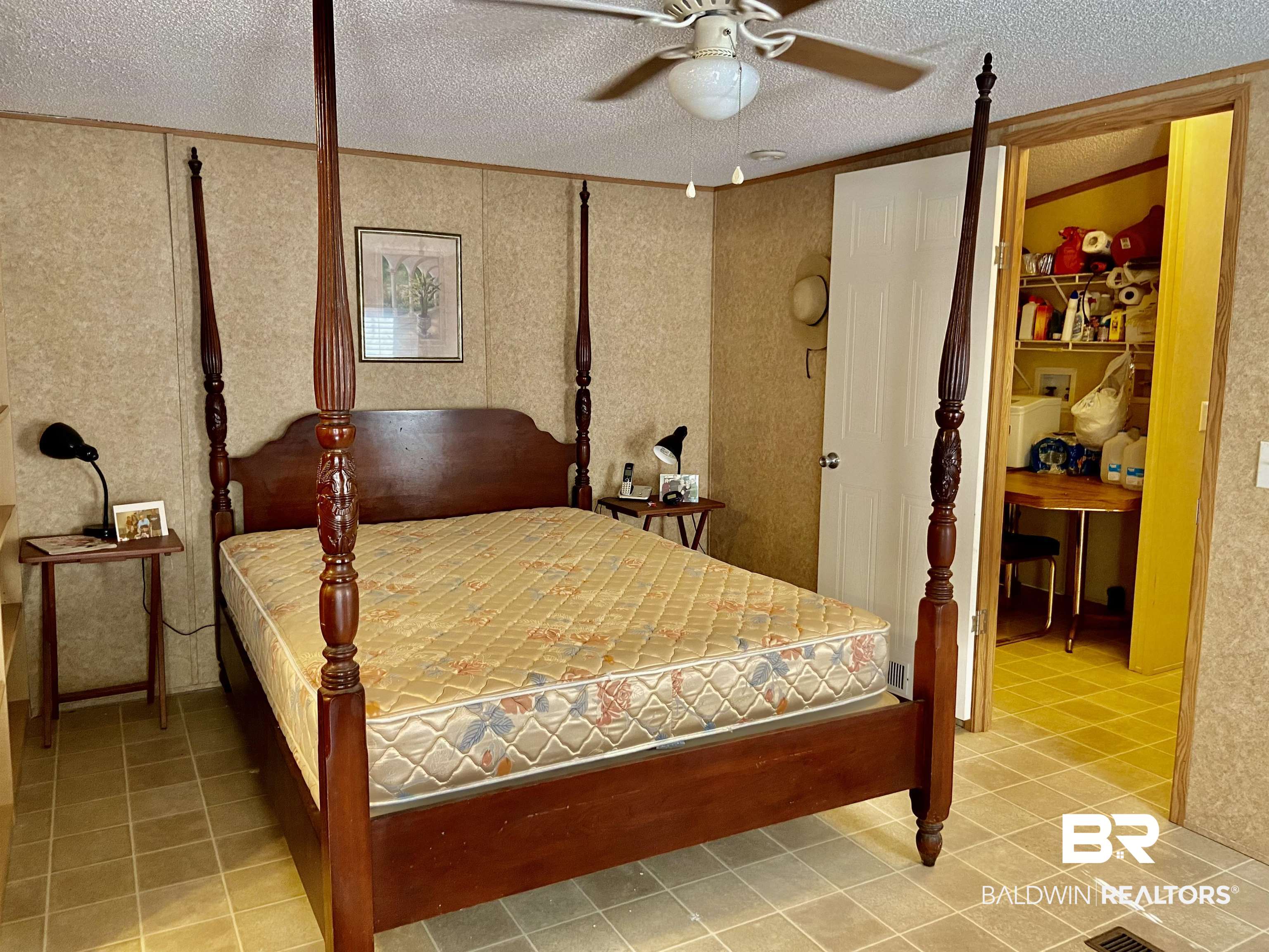 294 Eureka Way Uriah, AL 36480 - Photo 10 of 18 Bedroom with a textured ceiling, light tile patterned flooring, a ceiling fan, and crown molding