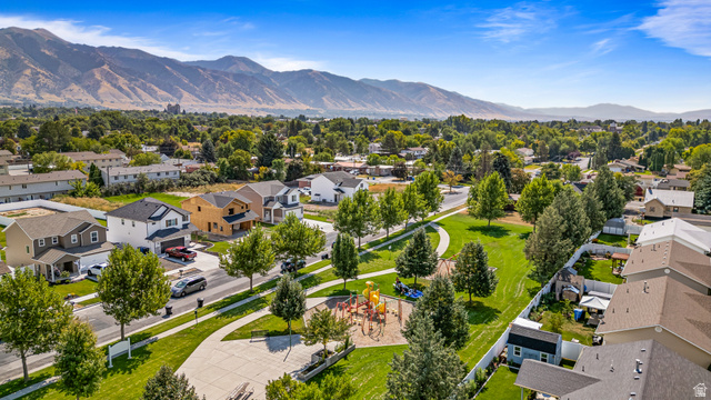 612 North 400 West Logan, UT 84321 - Photo 4 of 27 Aerial perspective showcasing a residential neighborhood with mountain backdrop
