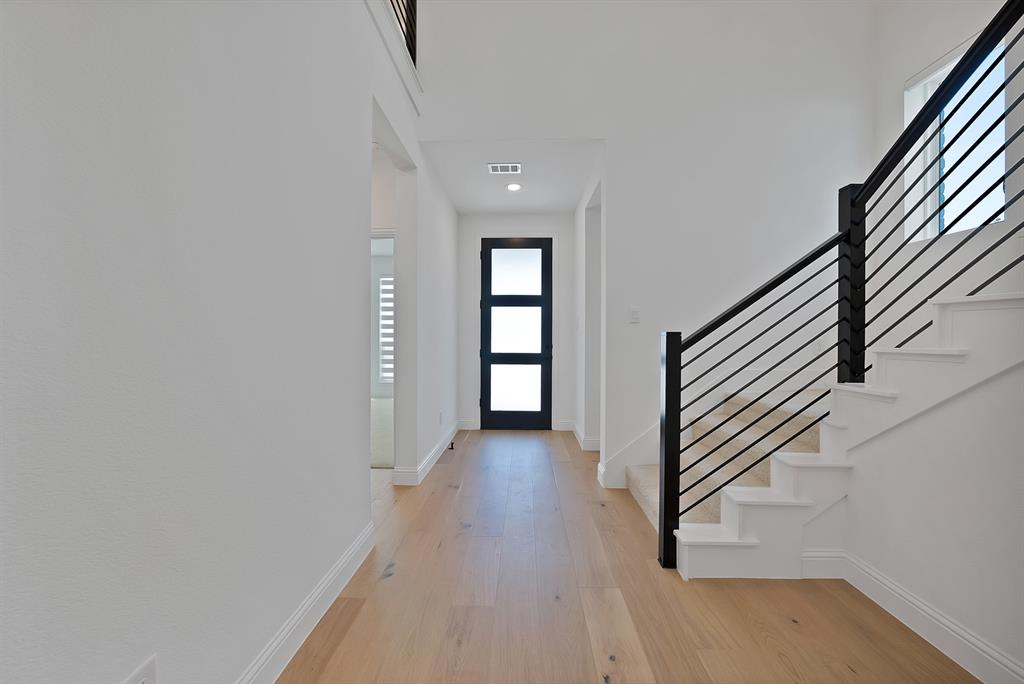 5012 Triadic Lane Prosper, TX 75078 - Photo 8 of 38 Entryway featuring light wood-finish flooring and white baseboards