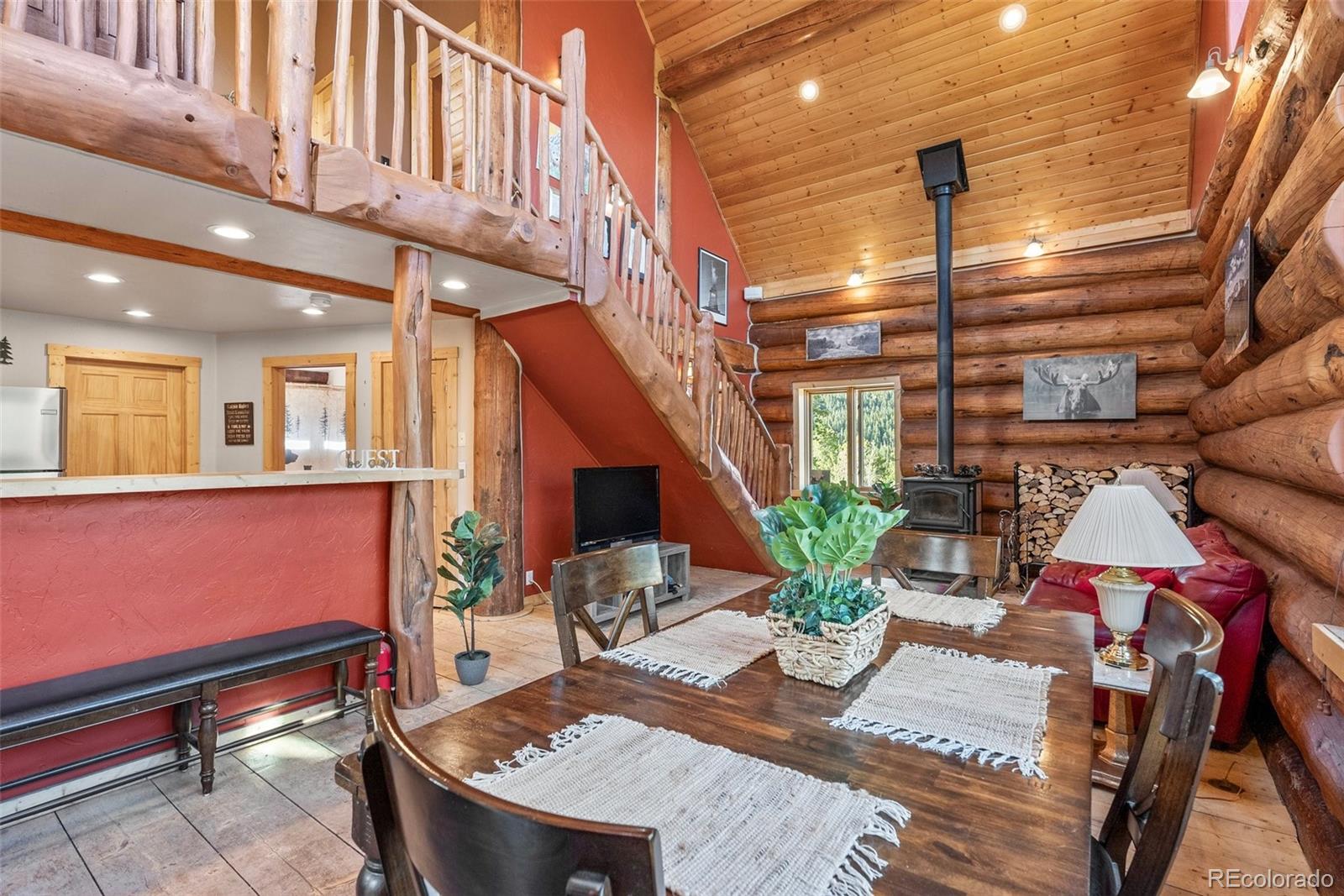 96 Eva Road Idaho Springs, CO 80452 - Photo 14 of 34 a view of a patio with couches table and chairs and potted plants