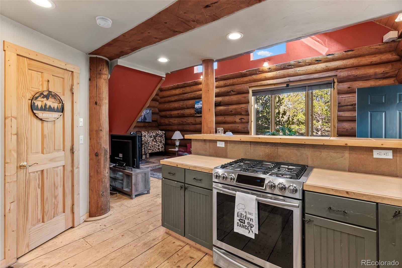 96 Eva Road Idaho Springs, CO 80452 - Photo 17 of 34 a kitchen with a stove and a microwave