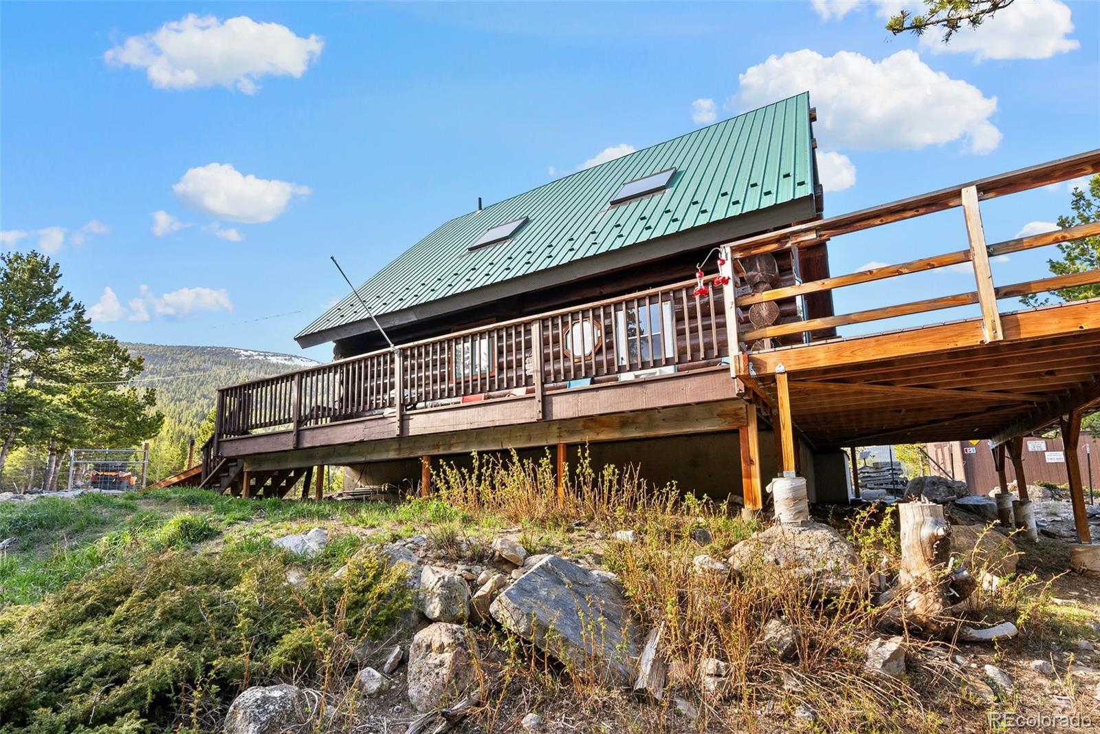 96 Eva Road Idaho Springs, CO 80452 - Photo 29 of 34 a front view of a building with a yard