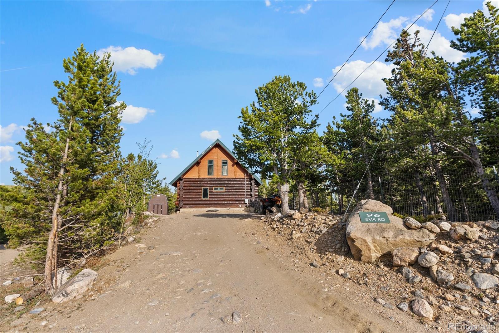 96 Eva Road Idaho Springs, CO 80452 - Photo 4 of 34 a dirt road with a building in the background