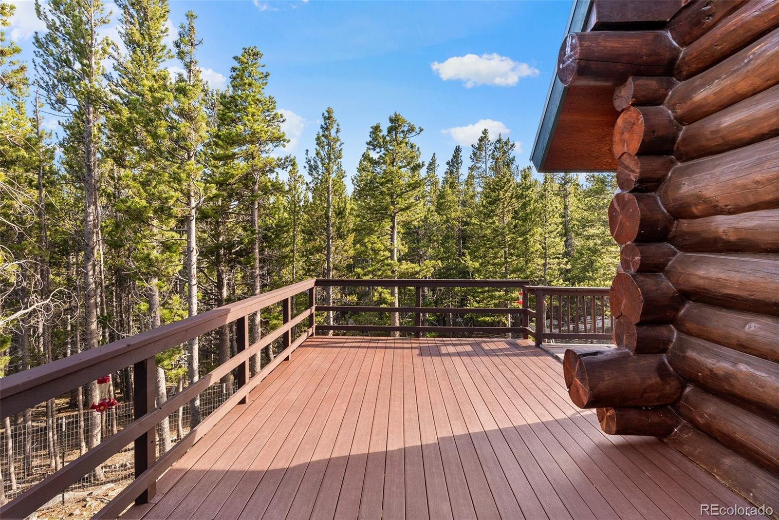96 Eva Road Idaho Springs, CO 80452 - Photo 8 of 34 a view of balcony with wooden floor and seating space