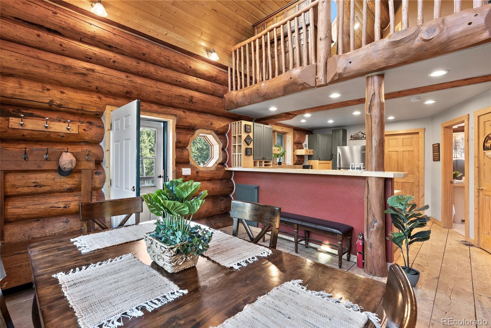 96 Eva Road Idaho Springs, CO 80452 - Photo 9 of 34 a living room with furniture and potted plants