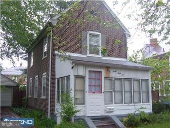 3042 Congress Road Camden, NJ 08104 - Photo 2 of 6 a view of a brick house with a large windows and large trees