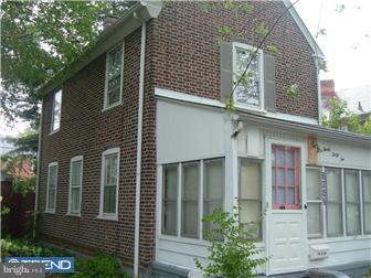 3042 Congress Road Camden, NJ 08104 - Photo 3 of 6 front view of a brick house with a large windows