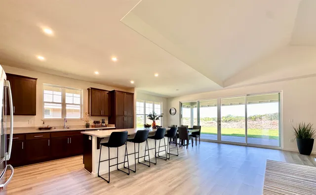a kitchen with lots of counter top space and living room