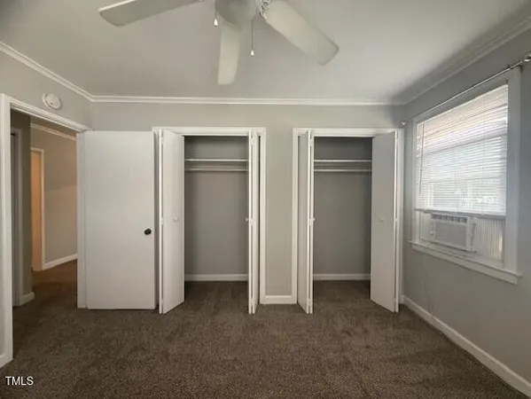 a view of empty room with closet