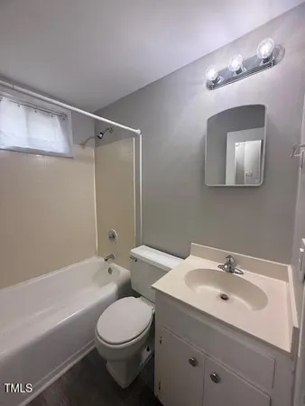 a bathroom with a toilet sink and bathtub