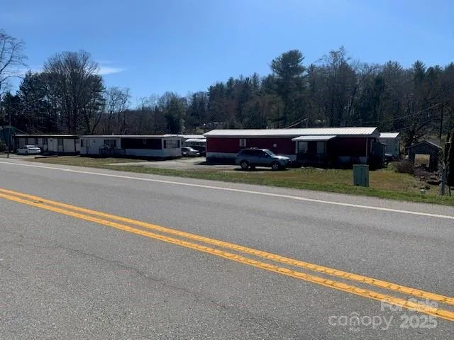 a house view with a car parked in front of it