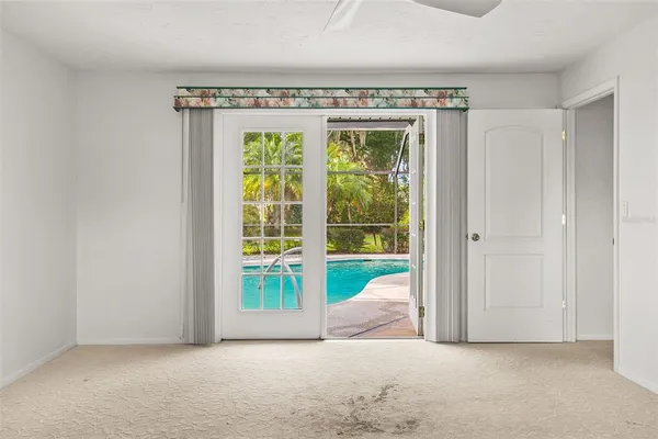 a view of an empty room with a window