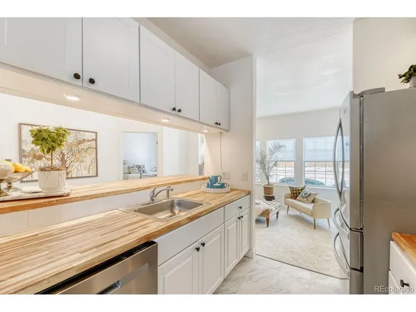 $305,000 | 4760 South Wadsworth Boulevard, Unit 107, Littleton, CO 80123