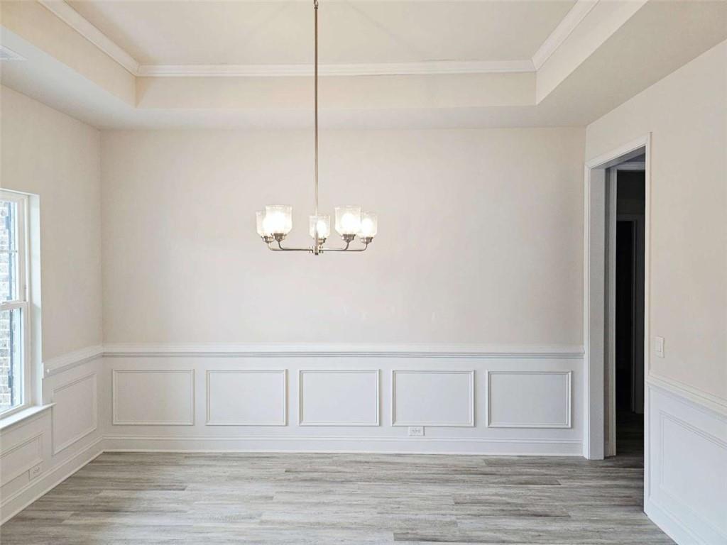 267 Eason Street Bowdon, GA 30108 - Photo 2 of 6 a view of empty room with wooden floor