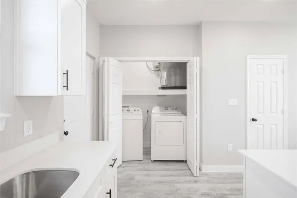a view of a hallway with white walls
