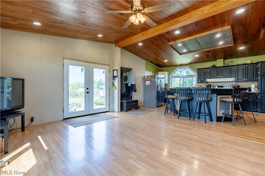 5267 Apollo Road Northeast Salineville, OH 43945 - Photo 11 of 33 Living area with light wood finished floors, french doors, a ceiling fan, recessed lighting, and wooden ceiling