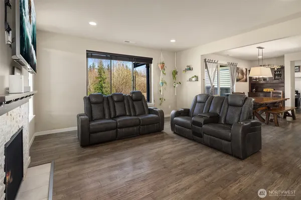 a living room with furniture fireplace and flat screen tv