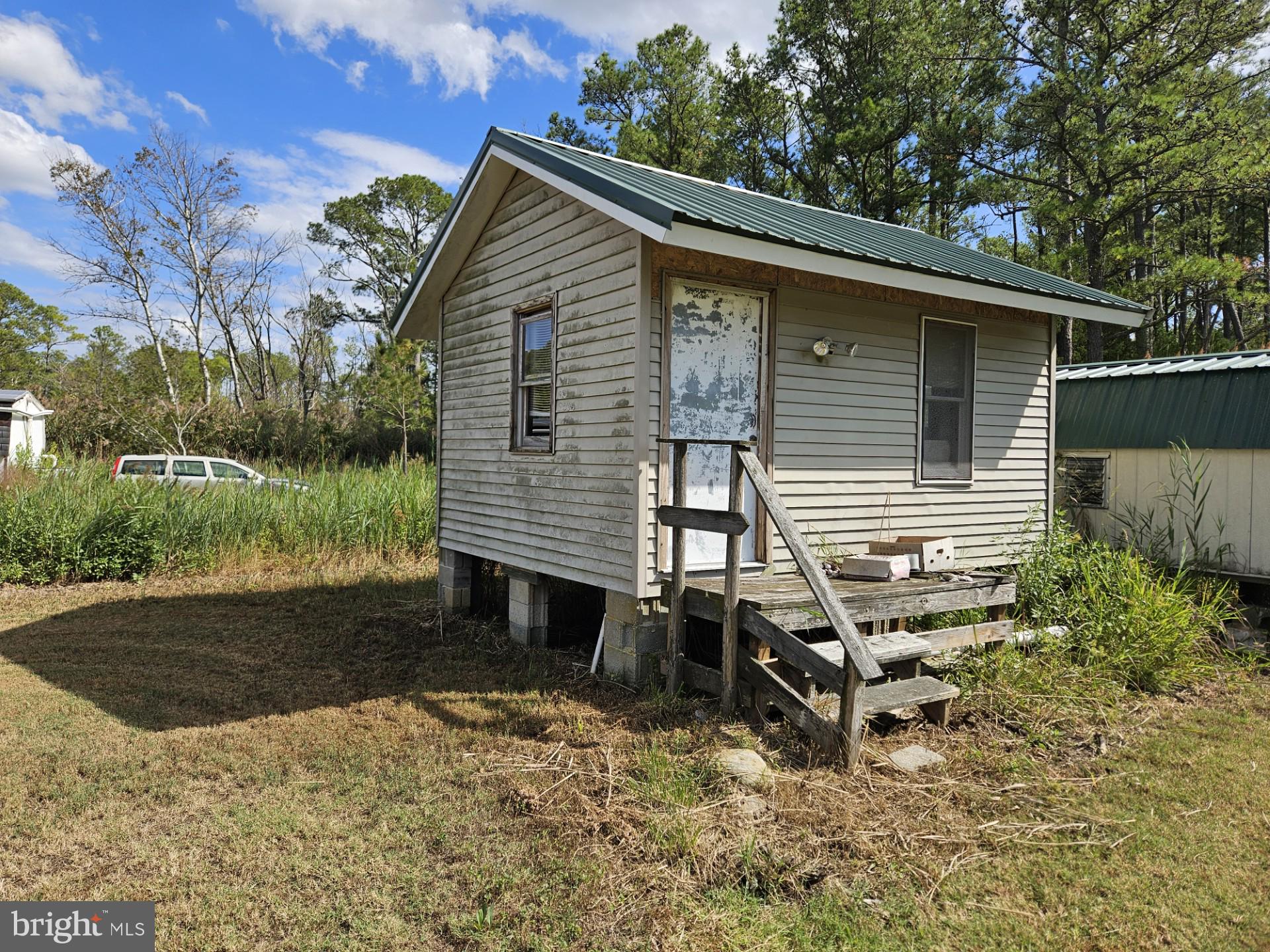 2796 Calvary Road Crisfield, MD 21817 - Photo 17 of 17 a front view of a house with garden