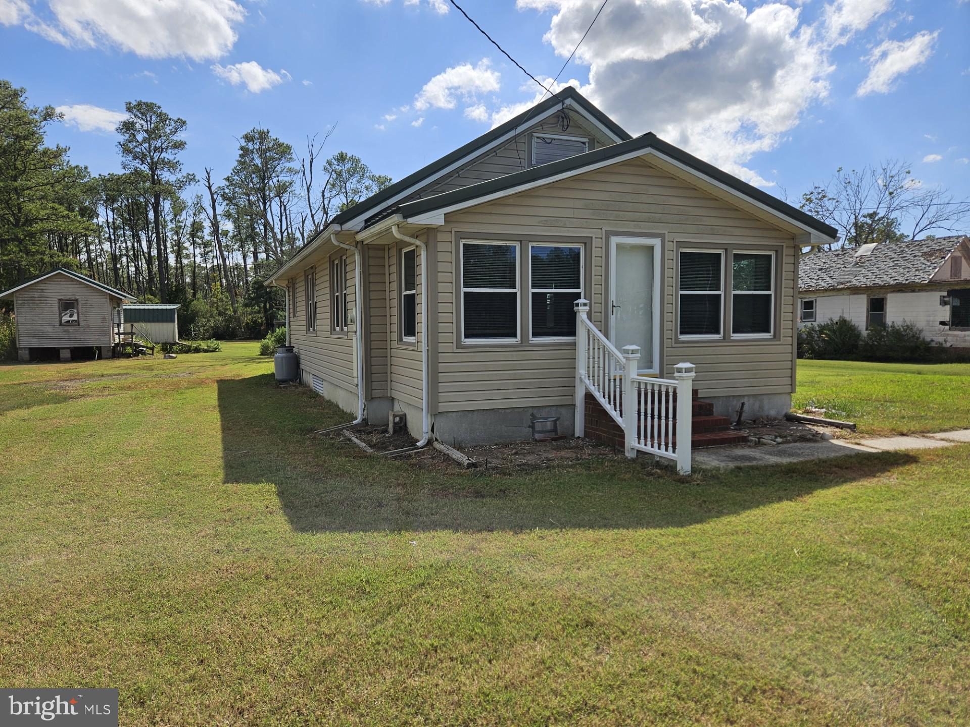 2796 Calvary Road Crisfield, MD 21817 - Photo 2 of 17 a view of a house with backyard and a tree