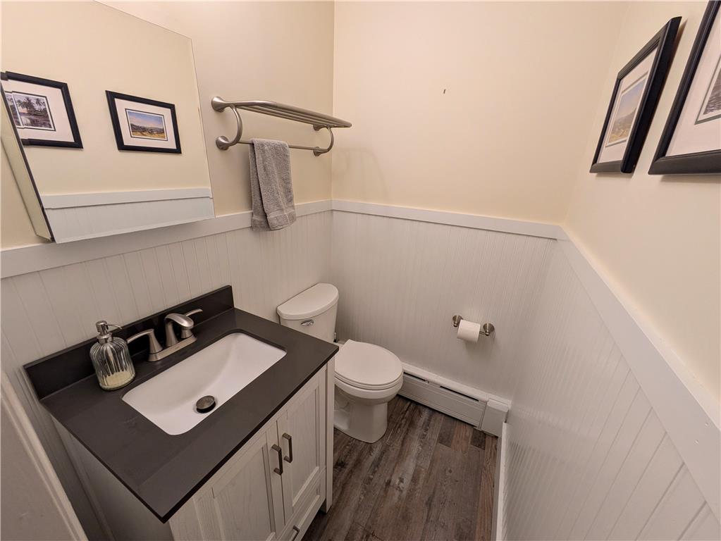 3285 Cherryville Road Northampton, PA 18067 - Photo 26 of 51 Beadboard wainscoting and durable wood-look flooring enhance this classic powder room.