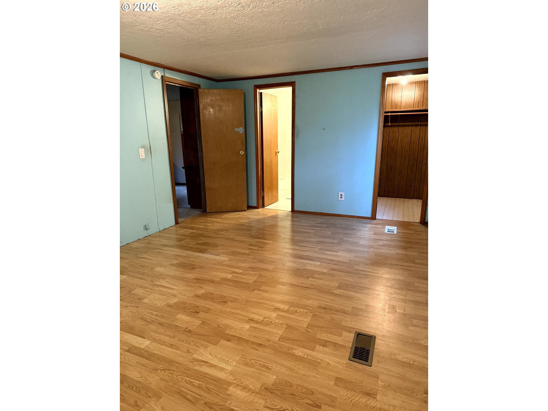 157 Rodgers Road Silverlake, WA 98645 - Photo 17 of 27 a view of an empty room with wooden floor