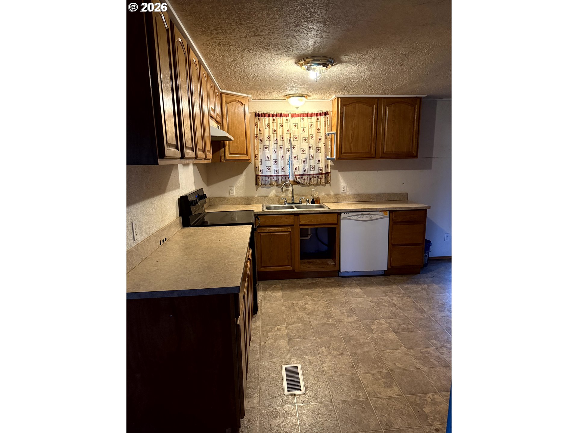 157 Rodgers Road Silverlake, WA 98645 - Photo 25 of 27 a kitchen with kitchen island granite countertop a sink and cabinets