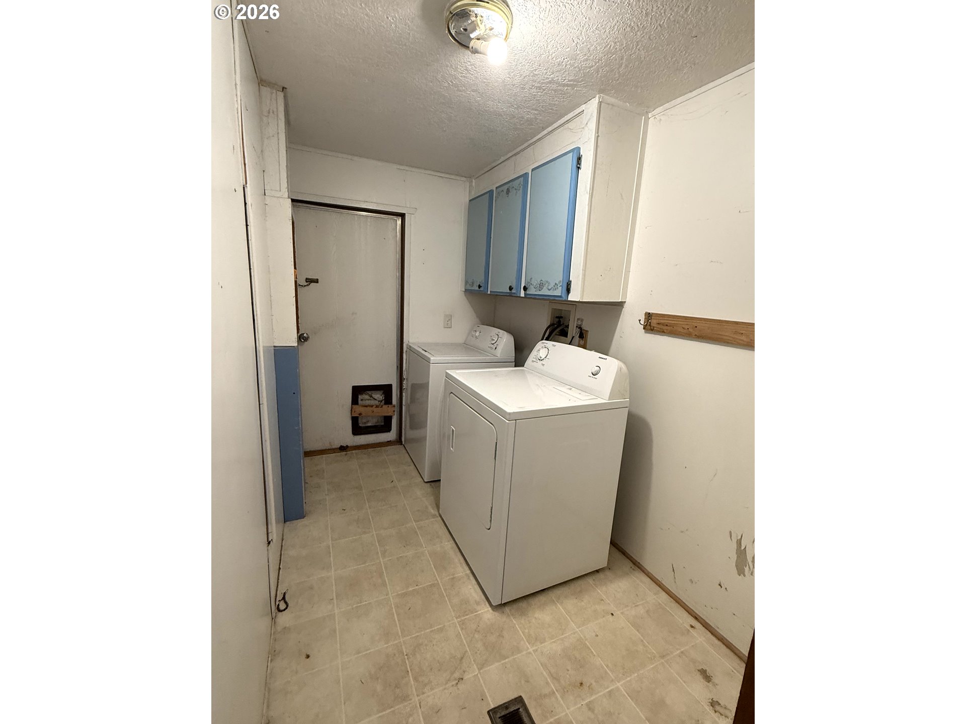 157 Rodgers Road Silverlake, WA 98645 - Photo 26 of 27 a utility room with dryer and washer