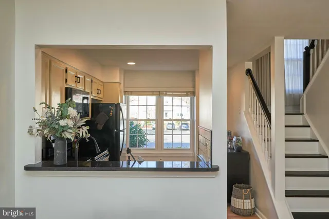 a vase of flowers sitting on a floor