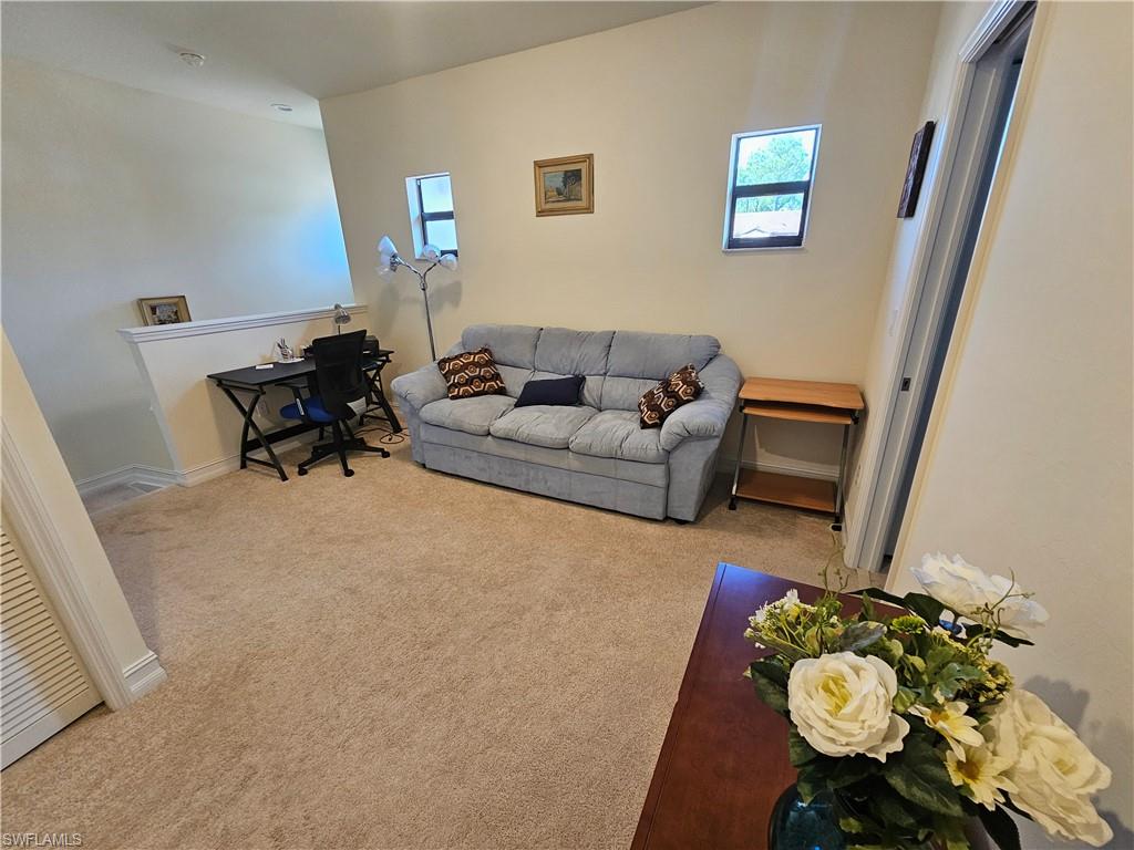 7914 Bristol Circle Naples, FL 34120 - Photo 17 of 22 a living room with furniture and a rug