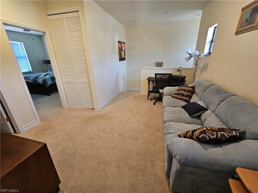 7914 Bristol Circle Naples, FL 34120 - Photo 8 of 22 a living room with furniture and a window