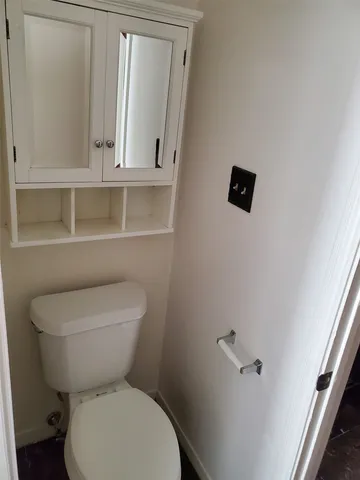 a bathroom with a tub and a window