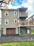 25 Glendower Road, Unit 2 Boston, MA 02131 - Photo 17 of 17 a front view of a house with a yard