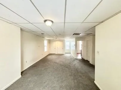 a bathroom with a tub shower and a sink