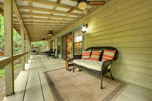 a view of a swimming pool with outdoor seating