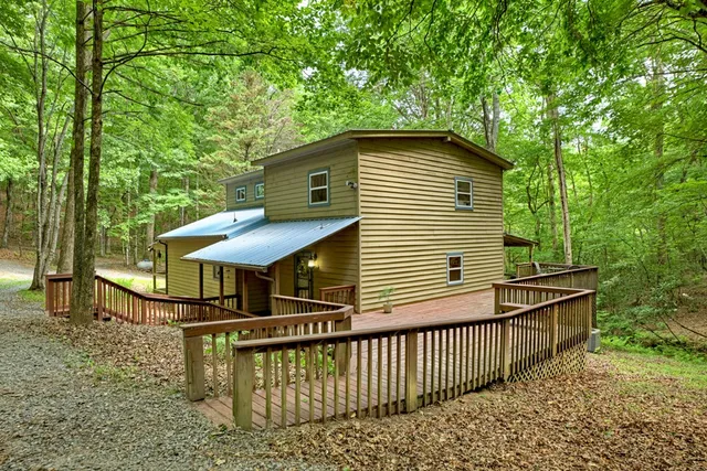 a kitchen with stainless steel appliances granite countertop a sink and wooden cabinets