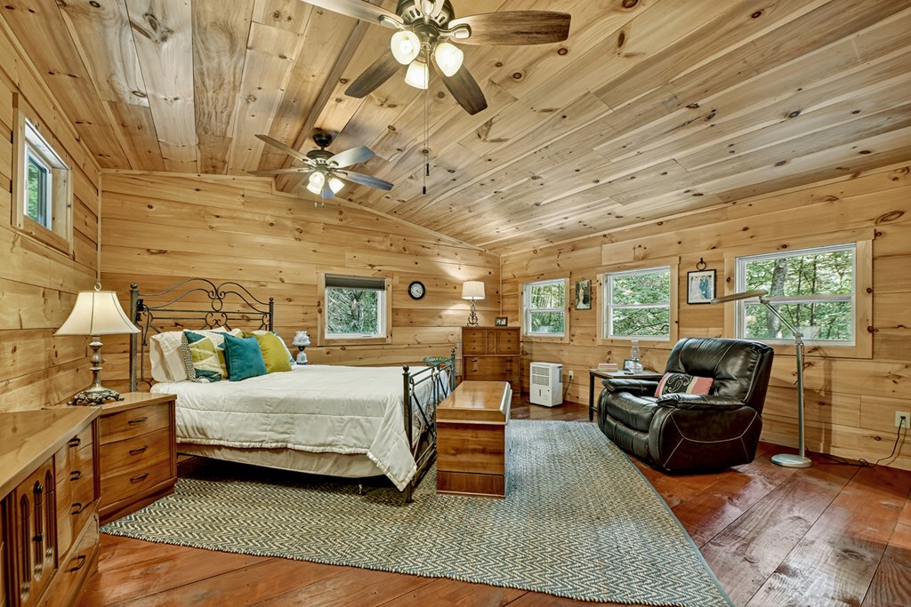 1431 Cashes Valley Lane Cherry Log, GA 30522 - Photo 28 of 57 a bedroom with furniture and large windows